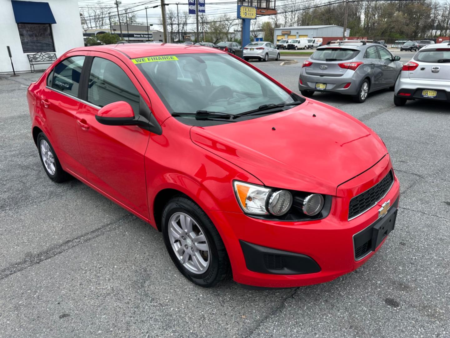 2015 RED Chevrolet Sonic LT Auto Sedan (1G1JC5SH6F4) with an 1.8L L4 DOHC 24V engine, 6-Speed Automatic transmission, located at 1254 Manheim Pike, Lancaster, PA, 17601, (717) 393-9133, 40.062870, -76.323273 - Photo#2